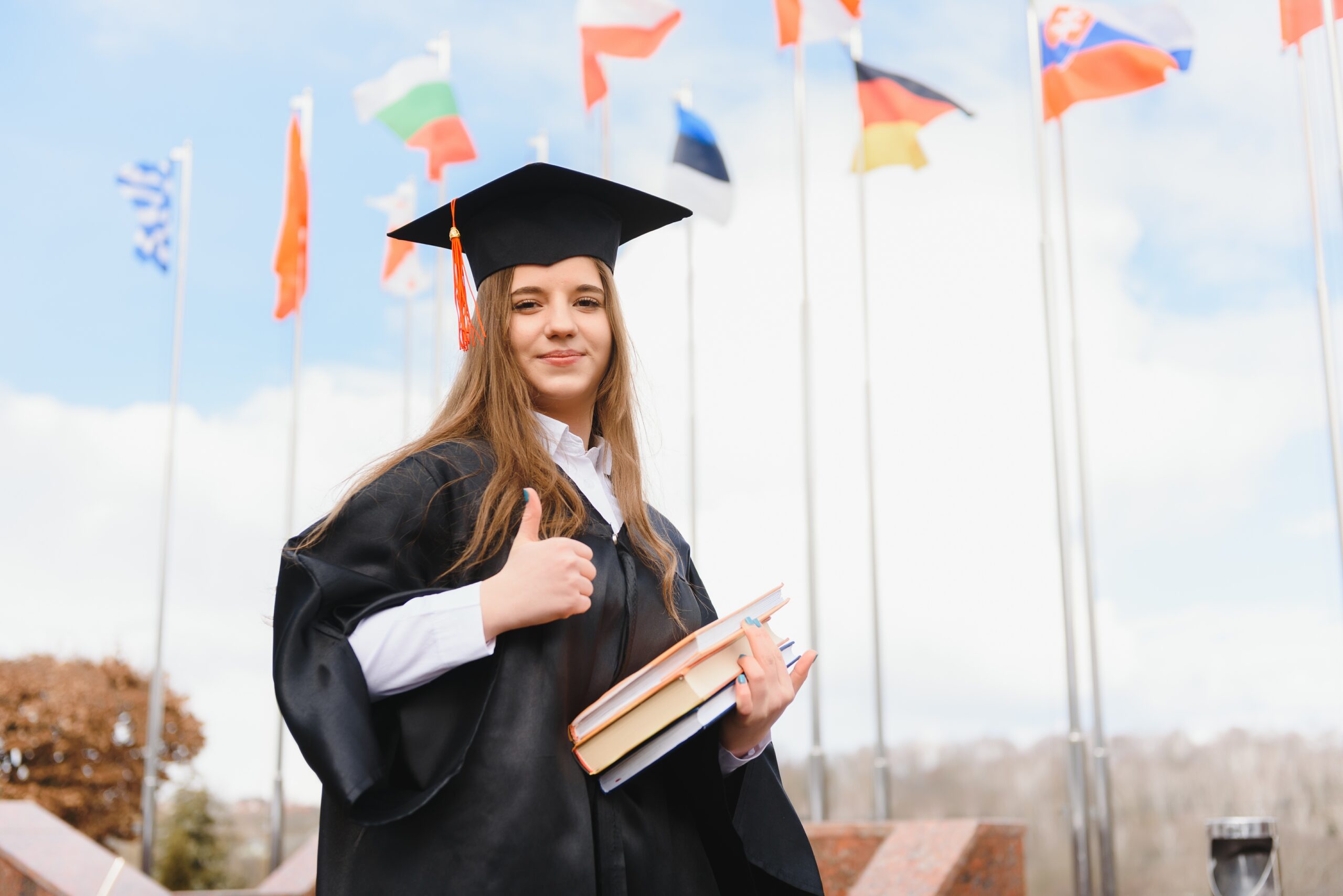 Educational theme: graduating student girl in an academic gown.